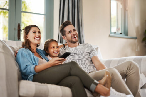 A young family watching a movie together in O'Fallon, MO